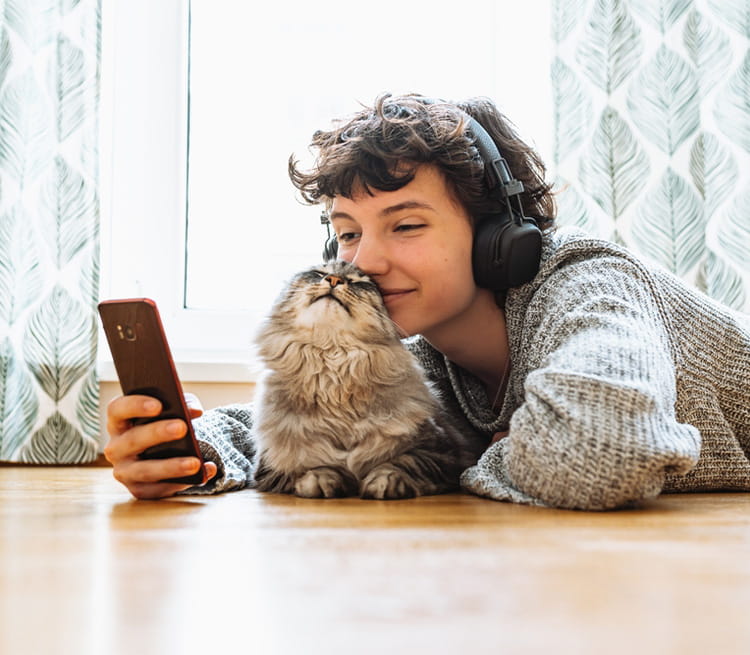 Woman lying down with her cat