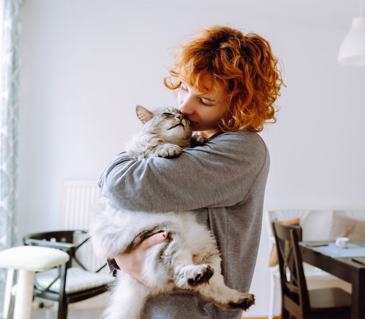 Woman holding her cat